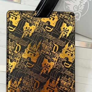 Disney Parks Gold and be Black luggage tag. New with tag.